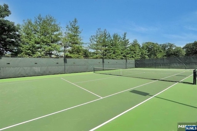 view of sport court with fence