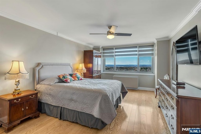 bedroom with light wood-style flooring, baseboards, a ceiling fan, and ornamental molding