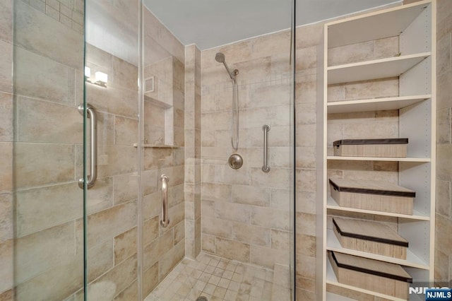 bathroom with a shower stall