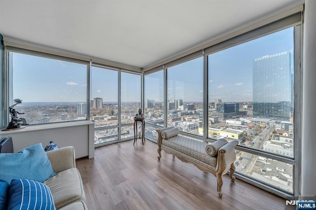 sunroom / solarium featuring a view of city