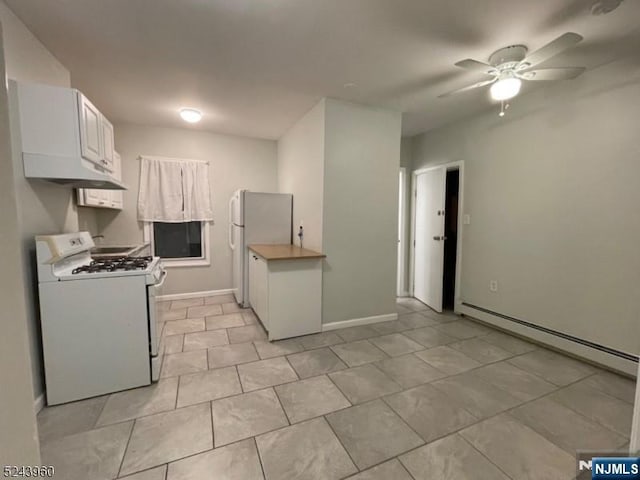 kitchen featuring ceiling fan, white appliances, white cabinets, light countertops, and baseboard heating