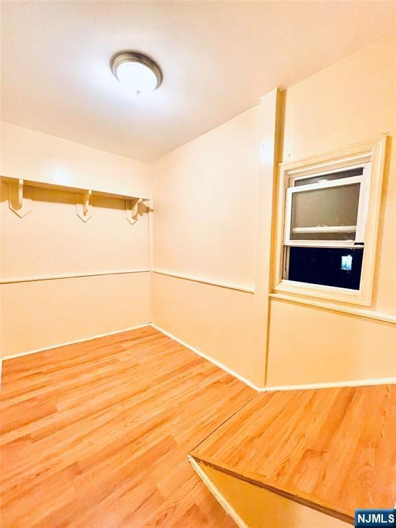 unfurnished room featuring light wood-type flooring