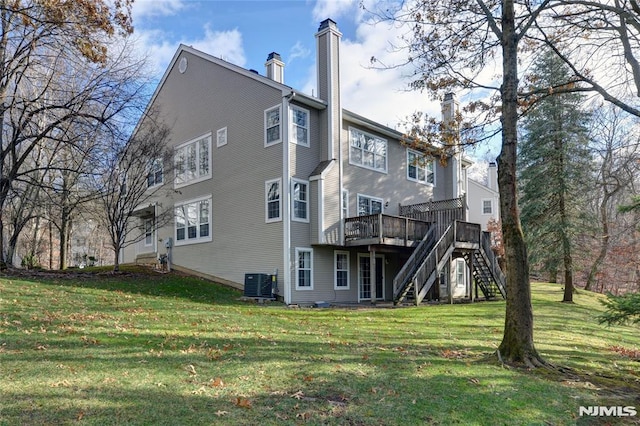 back of property featuring stairs, a lawn, cooling unit, a chimney, and a deck