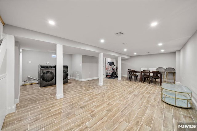 finished below grade area with recessed lighting, visible vents, and wood tiled floor