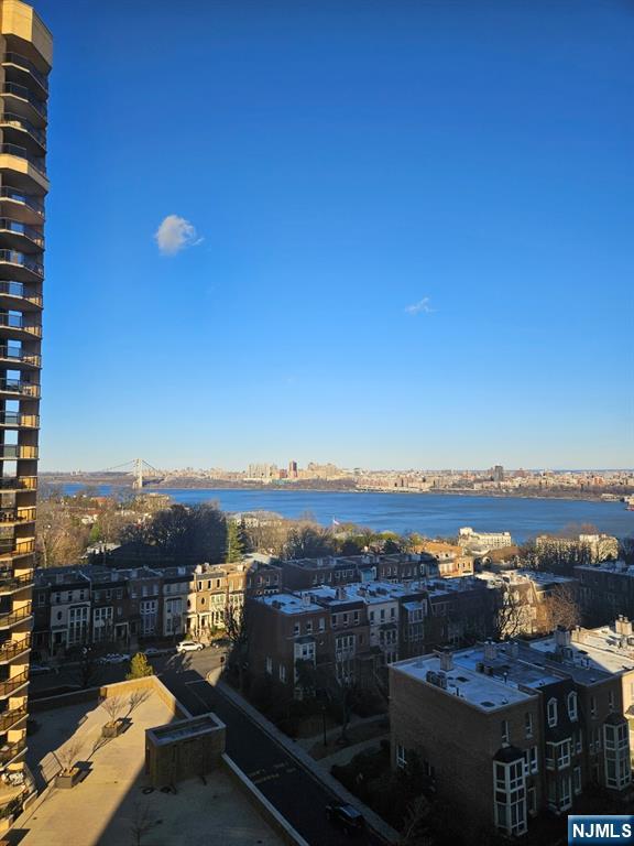 property's view of city featuring a water view