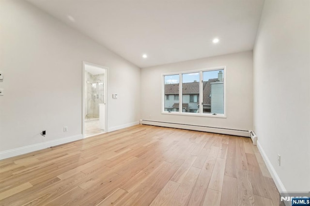 unfurnished room with a baseboard heating unit, baseboards, light wood-type flooring, lofted ceiling, and recessed lighting