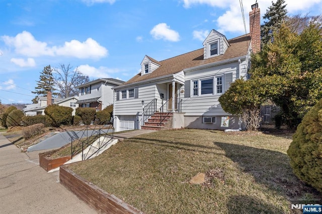 cape cod home with a shingled roof, a front lawn, concrete driveway, a chimney, and a garage