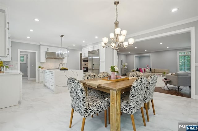 dining room with a notable chandelier, recessed lighting, marble finish floor, and ornamental molding