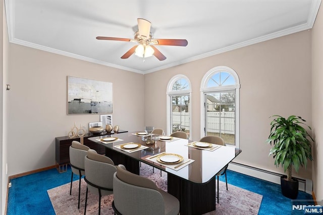 carpeted dining space with ornamental molding, a baseboard radiator, ceiling fan, and baseboards