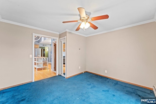 empty room featuring a baseboard radiator, a ceiling fan, baseboards, ornamental molding, and carpet