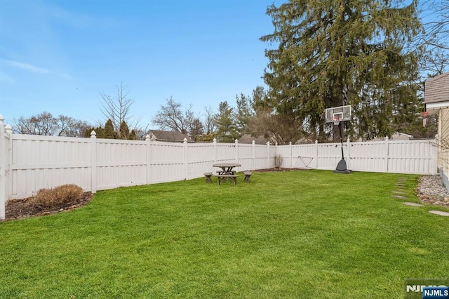 view of yard with a fenced backyard