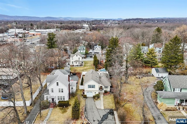 birds eye view of property with a residential view and a mountain view