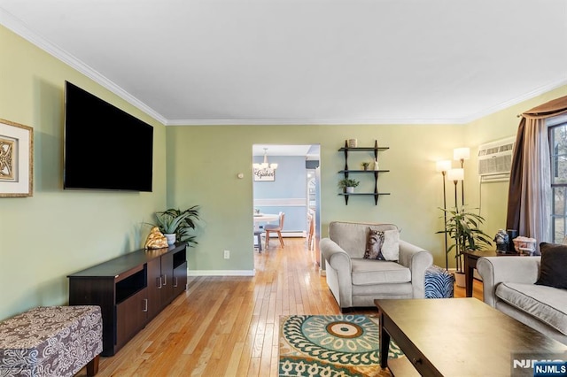 living room with crown molding, an inviting chandelier, baseboards, and light wood-style floors