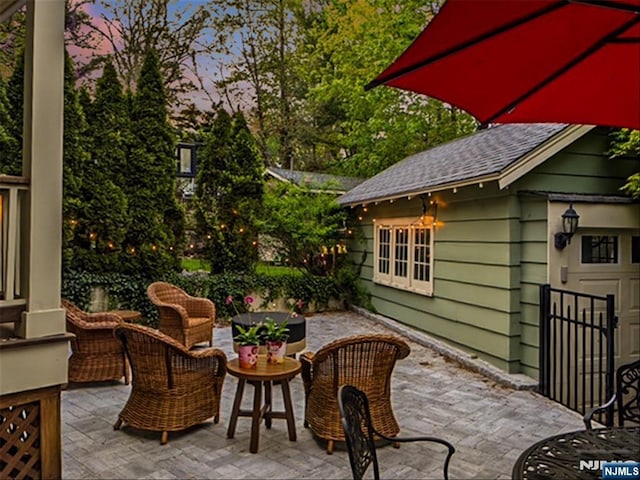 view of patio terrace at dusk