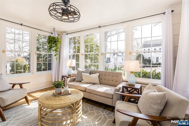 sunroom / solarium featuring a healthy amount of sunlight