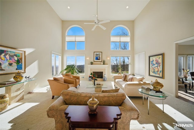 carpeted living room with recessed lighting, a fireplace, a ceiling fan, and baseboards