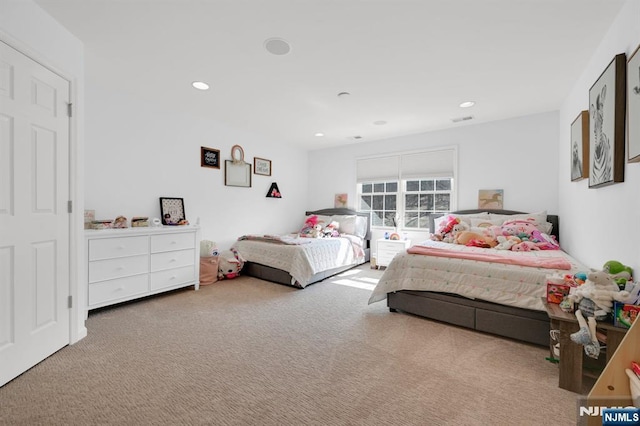 carpeted bedroom featuring recessed lighting and visible vents