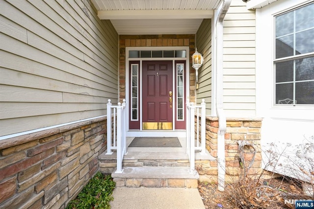 view of exterior entry with stone siding