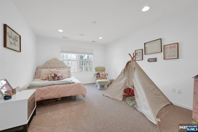 carpeted bedroom featuring recessed lighting, visible vents, and baseboards