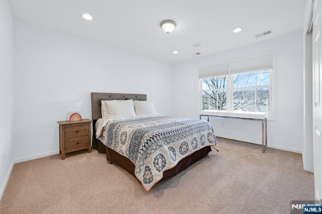 carpeted bedroom with visible vents, recessed lighting, and baseboards