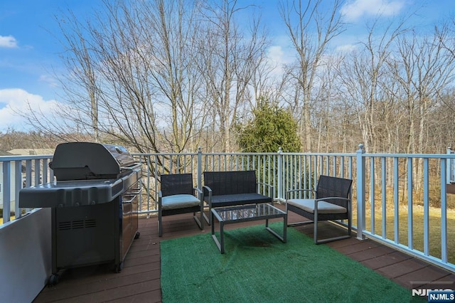 wooden terrace featuring an outdoor hangout area