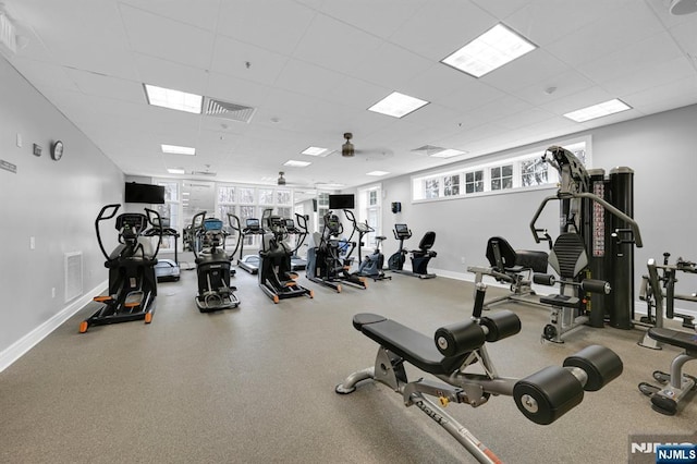 gym featuring a drop ceiling, baseboards, and visible vents