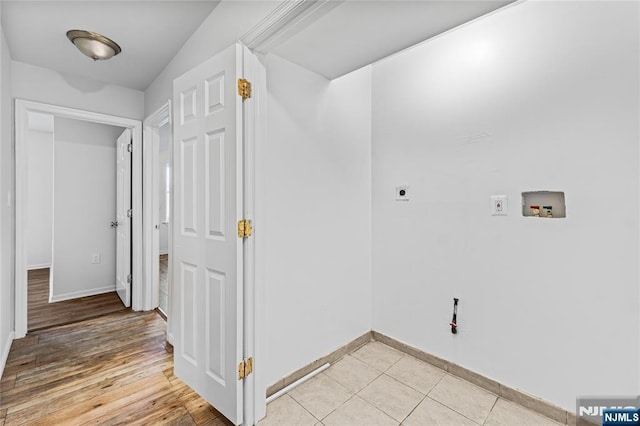 laundry area with washer hookup, light tile patterned floors, baseboards, hookup for an electric dryer, and laundry area