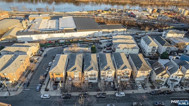 birds eye view of property with a residential view and a water view