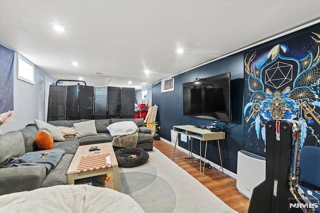 living area featuring recessed lighting, baseboards, and wood finished floors