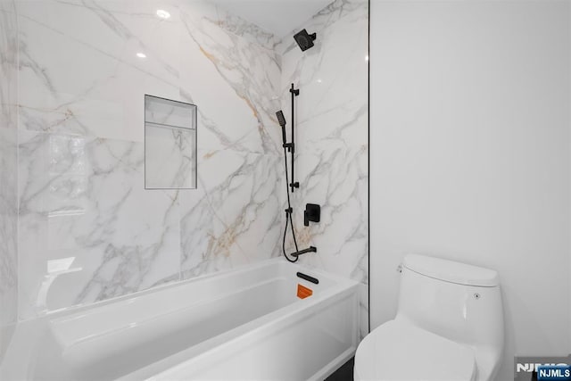 bathroom with toilet and a combined bath / shower with marble appearance