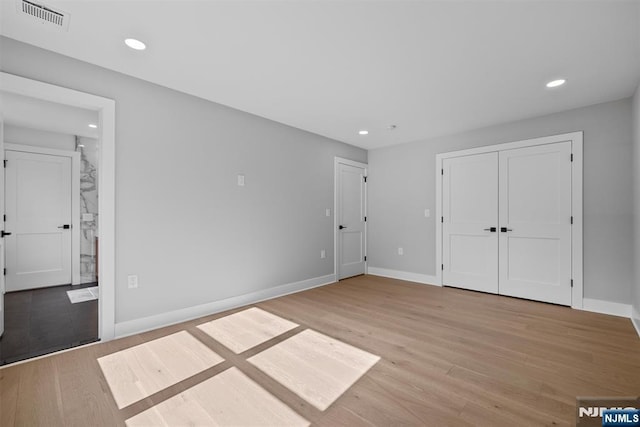 unfurnished bedroom with visible vents, recessed lighting, baseboards, and light wood-style floors