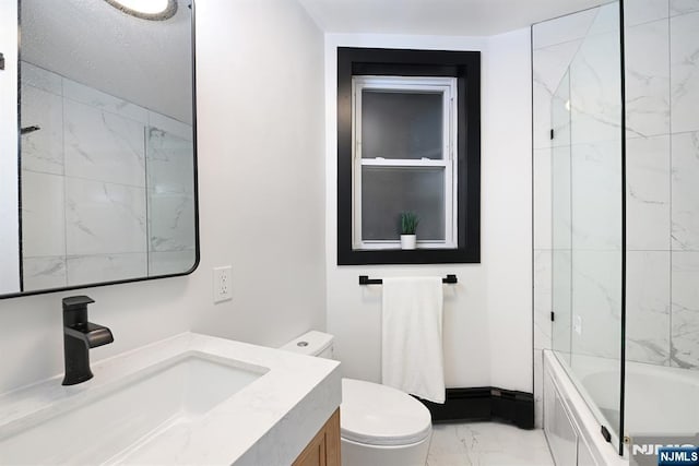 bathroom with baseboards, toilet, shower / tub combination, marble finish floor, and vanity