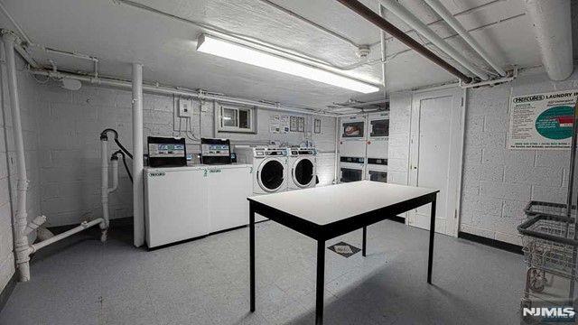 shared laundry area featuring washing machine and clothes dryer