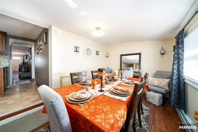 dining room with lofted ceiling