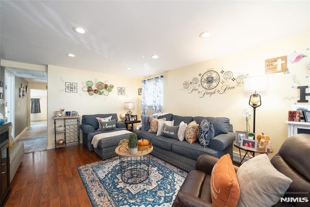 living area with recessed lighting and wood finished floors