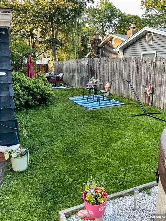 view of yard featuring a patio area and fence