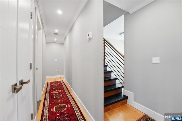 hall with wood finished floors, stairs, visible vents, baseboards, and recessed lighting
