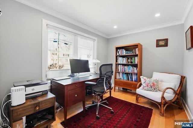 home office featuring light wood finished floors, baseboards, ornamental molding, and recessed lighting