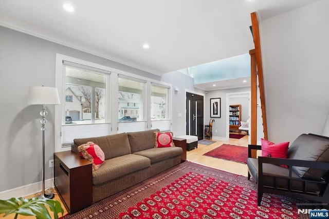 living room featuring crown molding, wood finished floors, baseboards, and recessed lighting