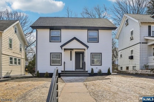 view of front of home featuring roof with shingles