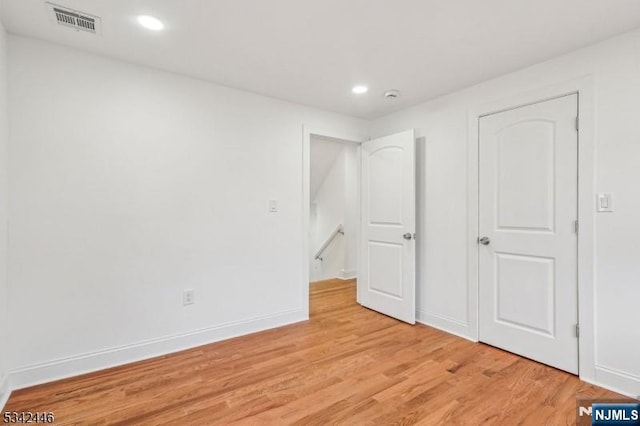 unfurnished bedroom with recessed lighting, visible vents, baseboards, and light wood-style floors