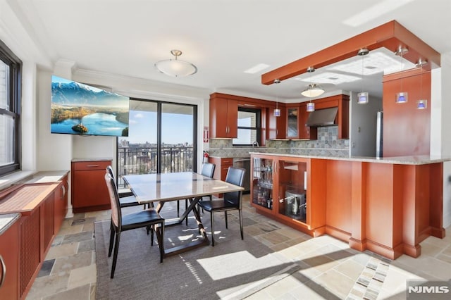 dining area featuring stone tile flooring