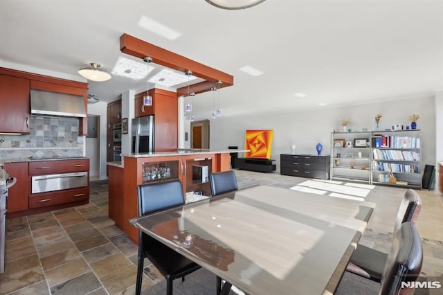 dining area featuring stone finish floor