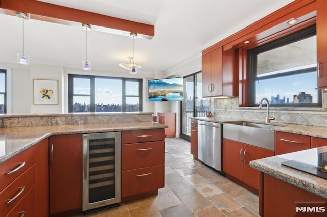 kitchen with beverage cooler, a sink, decorative backsplash, dishwasher, and hanging light fixtures