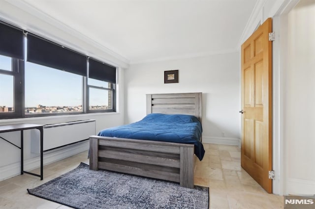 bedroom with stone finish flooring, baseboards, and crown molding