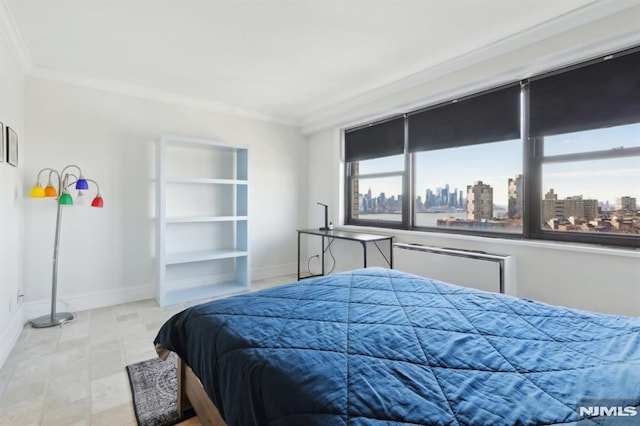 bedroom featuring baseboards, a view of city, and ornamental molding