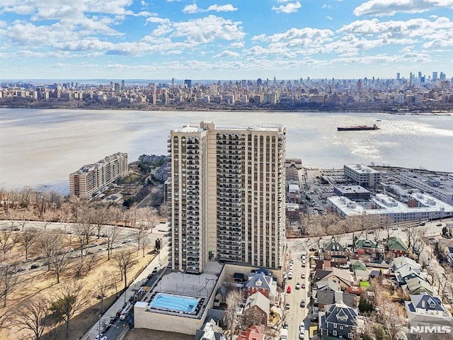 drone / aerial view featuring a water view and a city view