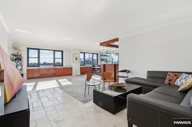 living room with crown molding and stone tile flooring