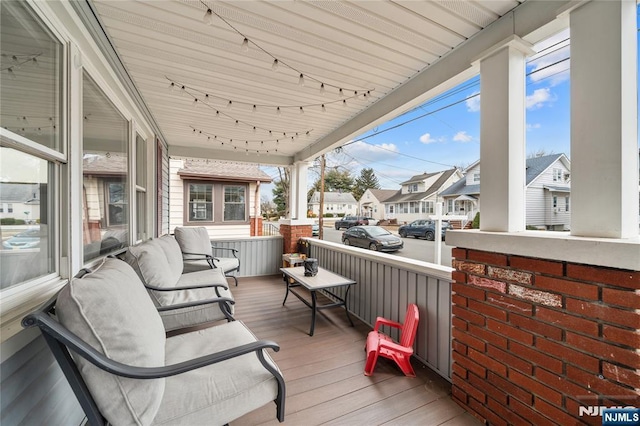 wooden terrace with a residential view