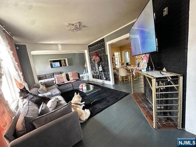 living area with wood-type flooring and beverage cooler